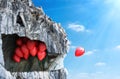 ÃÂ¡oncept of freedom. The balloon flies out of the cave and rushes into the sky. Concept of decisiveness.